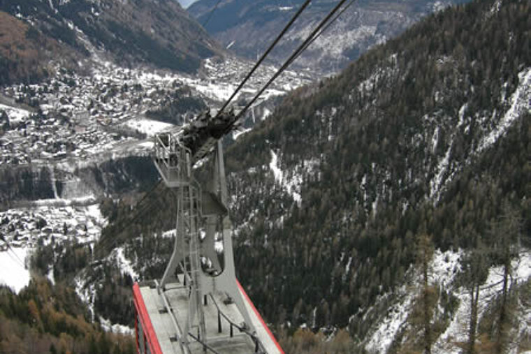 A red cable car with the word maya on the side