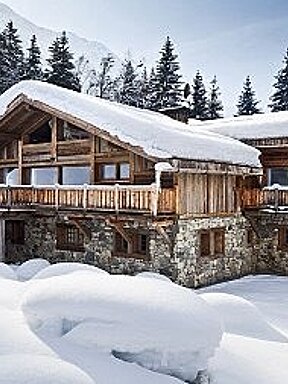 an image of a wood and stone chalet in the snow